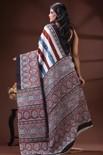 Earthy multicolor malmal cotton saree with block-print style borders and horizontal stripe body