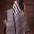Earthy multicolor malmal cotton saree with block-print style borders and horizontal stripe body