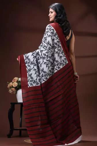 Maroon & monochrome malmal cotton saree with hand-block leaf prints and striped pallu