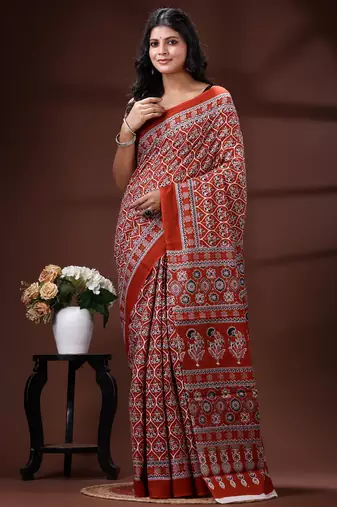 Rust red  malmal cotton saree with all-over traditional hand-block prints and panelled pallu