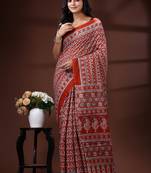 Rust red  malmal cotton saree with all-over traditional hand-block prints and panelled pallu