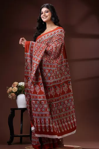 Rust red  malmal cotton saree with all-over traditional hand-block prints and panelled pallu