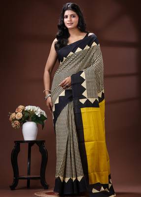 Bold geometric malmal cotton saree in black & cream with vibrant yellow block borders 1