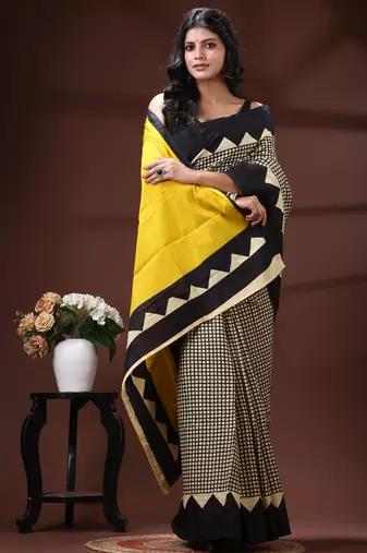 Bold geometric malmal cotton saree in black & cream with vibrant yellow block borders