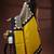Bold geometric malmal cotton saree in black & cream with vibrant yellow block borders