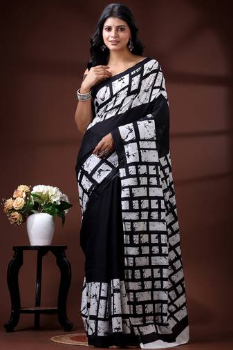 Monochrome abstract grid malmal cotton saree with bold black & white batik-style prints