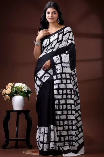 Monochrome abstract grid malmal cotton saree with bold black & white batik-style prints