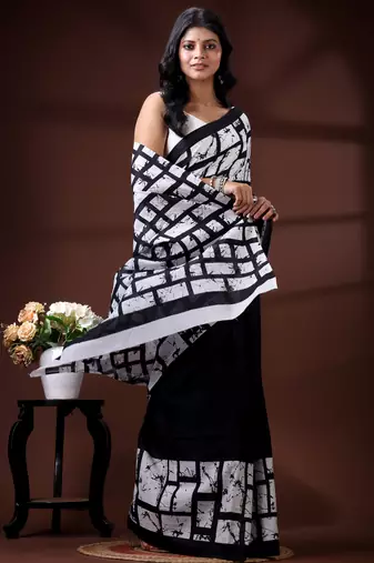 Monochrome abstract grid malmal cotton saree with bold black & white batik-style prints