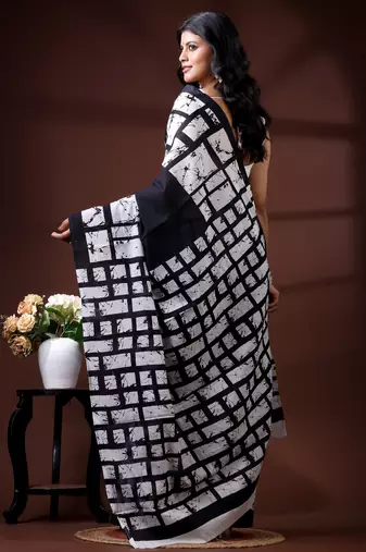 Monochrome abstract grid malmal cotton saree with bold black & white batik-style prints