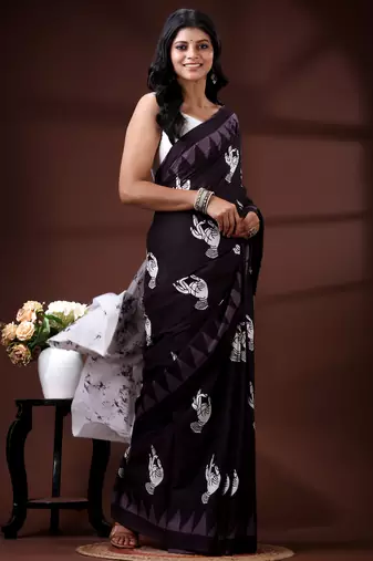 Deep wine malmal cotton saree with white bird & temple block prints and abstract panelled pallu