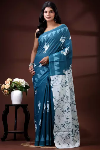 Ocean teal malmal cotton saree with white bird motifs and geometric temple border prints