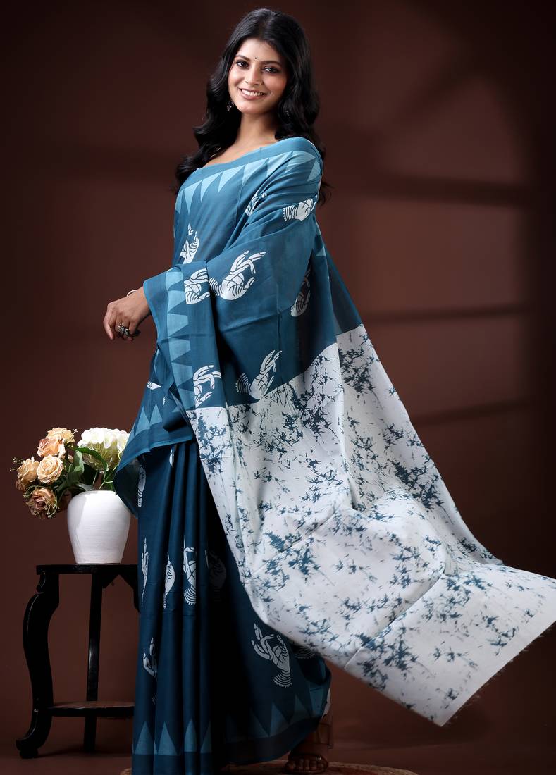 Ocean teal malmal cotton saree with white bird motifs and geometric temple border prints