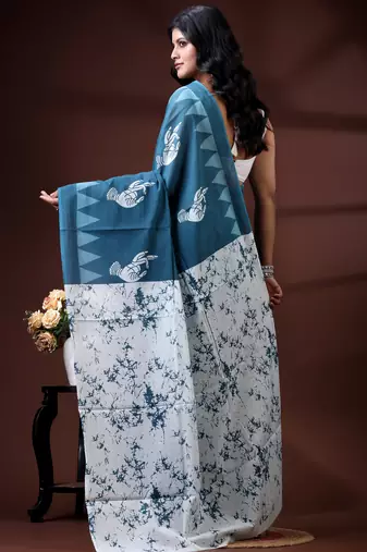 Ocean teal malmal cotton saree with white bird motifs and geometric temple border prints