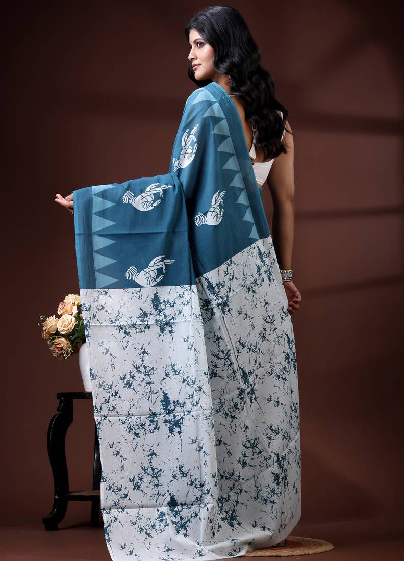 Ocean teal malmal cotton saree with white bird motifs and geometric temple border prints