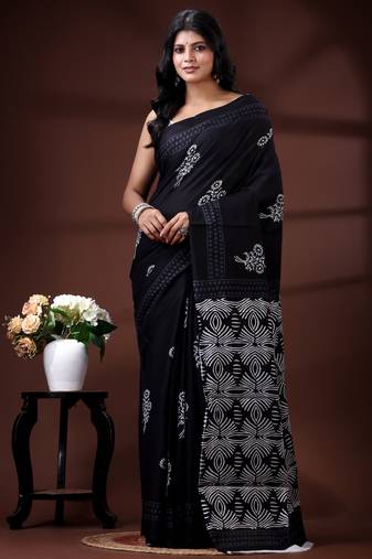 Jet black  malmal cotton saree with white floral butis and ornate geometric pallu
