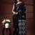 Jet black  malmal cotton saree with white floral butis and ornate geometric pallu
