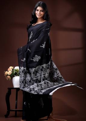 Jet black  malmal cotton saree with white floral butis and ornate geometric pallu 2