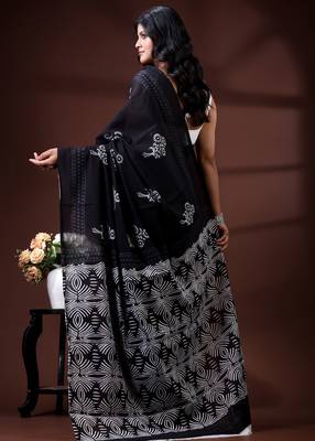 Jet black  malmal cotton saree with white floral butis and ornate geometric pallu 3