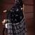 Jet black  malmal cotton saree with white floral butis and ornate geometric pallu