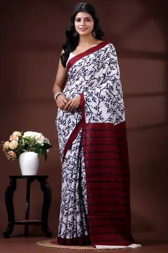 Indigo blue & white malmal cotton saree with hand-block leaf prints and contrast maroon pallu