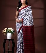 Indigo blue & white malmal cotton saree with hand-block leaf prints and contrast maroon pallu