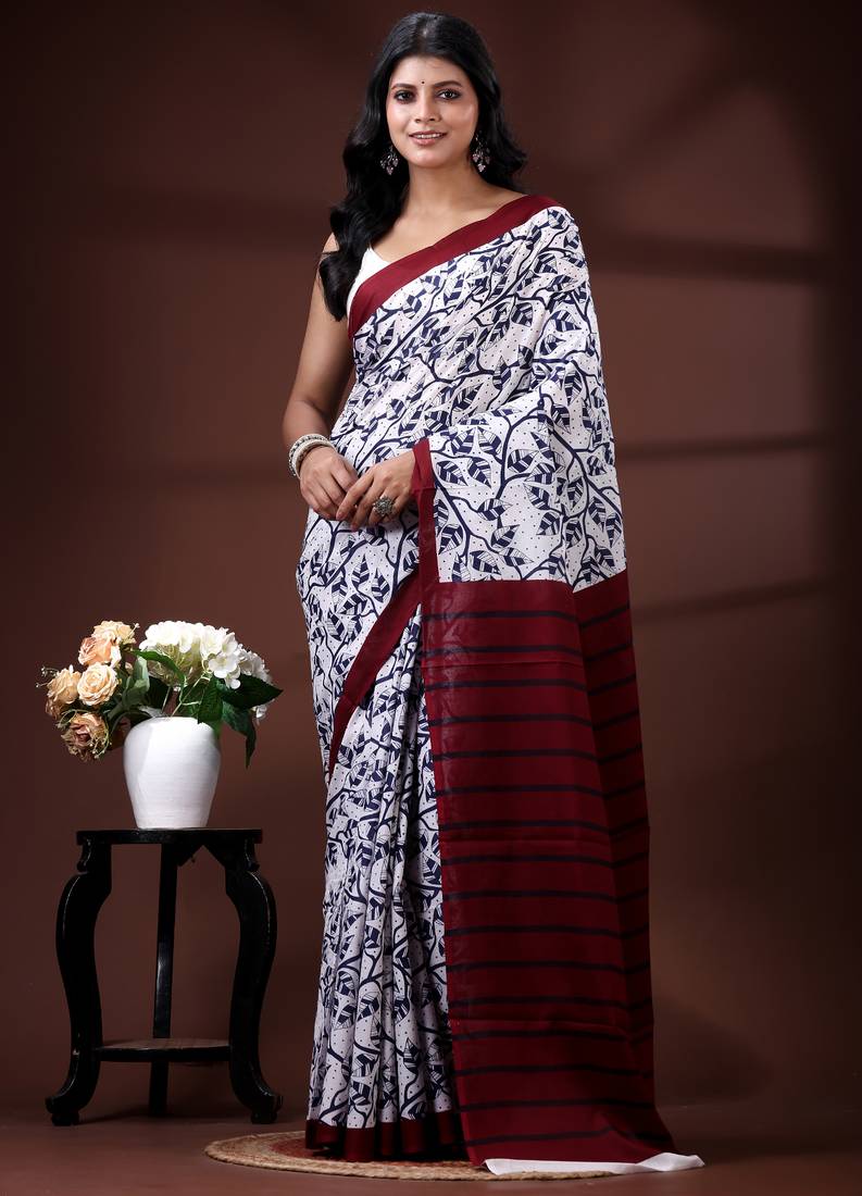 Indigo blue & white malmal cotton saree with hand-block leaf prints and contrast maroon pallu