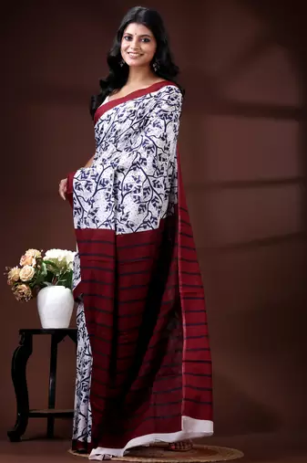 Indigo blue & white malmal cotton saree with hand-block leaf prints and contrast maroon pallu