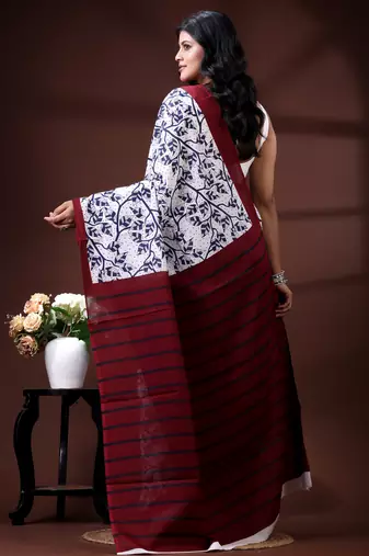 Indigo blue & white malmal cotton saree with hand-block leaf prints and contrast maroon pallu