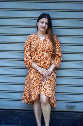 orange printed frill dress