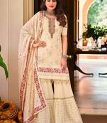 Faux georgette party wear readymade sharara suit in off white color with embroidery work