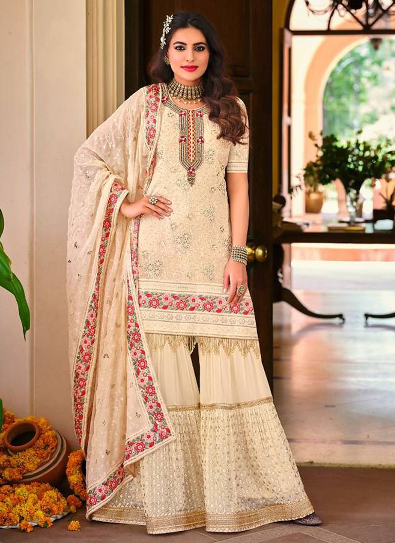 Faux georgette party wear readymade sharara suit in off white color with embroidery work