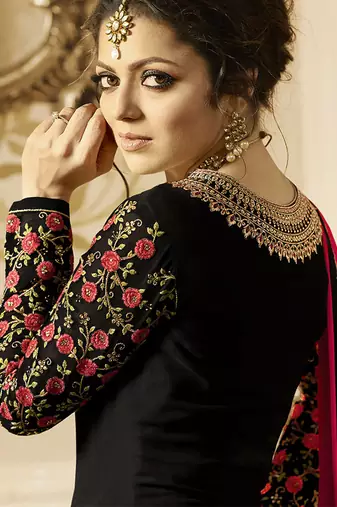 Heavy georgette party wear gown in black color with stone work