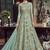 Soft premium net party wear readymade gown in turquoise color with zari with stone work