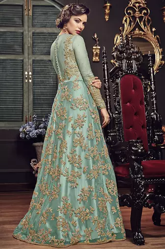 Soft premium net party wear readymade gown in turquoise color with zari with stone work