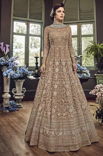 Soft premium net wedding wear gown in light brown color with embroidery & stone work