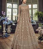 Soft premium net wedding wear gown in light brown color with embroidery & stone work