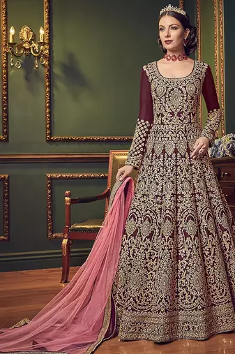 Silk wedding wear gown in maroon color with embroidery & stone work