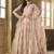 Soft net party wear gown peach color with zari with embroidery & stone work