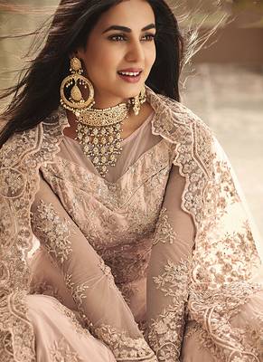 Soft net party wear gown peach color with zari with embroidery & stone work 2