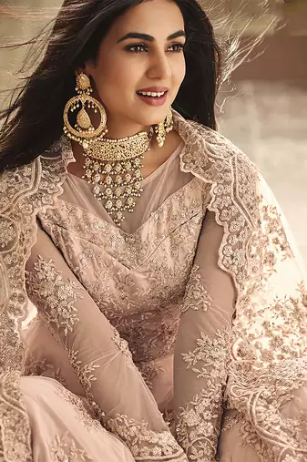 Soft net party wear gown peach color with zari with embroidery & stone work