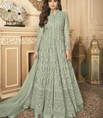Butterfly net fabrics party wear readymade gown in light green color with embroidery work