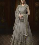 Soft butter net wedding wear gown in grey color with embrodiery & swarovski work
