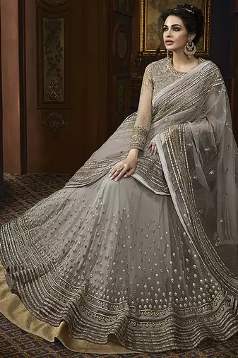 Soft butter net wedding wear gown in grey color with embrodiery & swarovski work