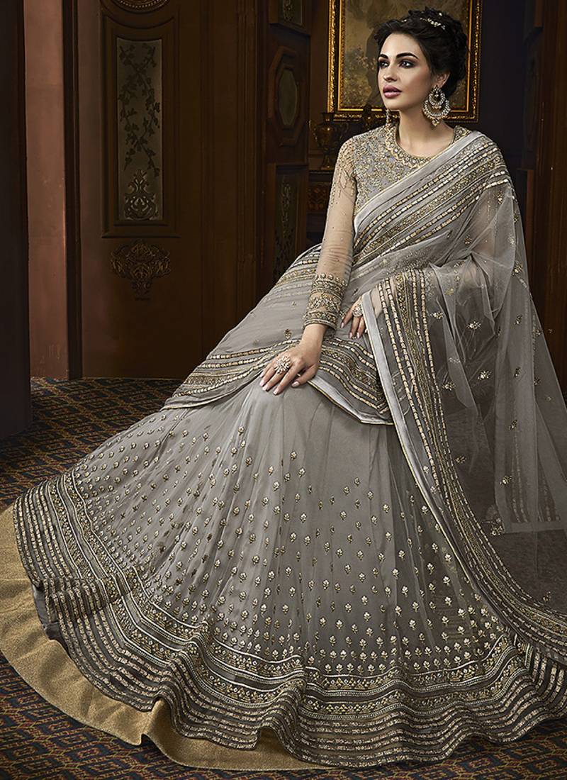 Soft butter net wedding wear gown in grey color with embrodiery & swarovski work
