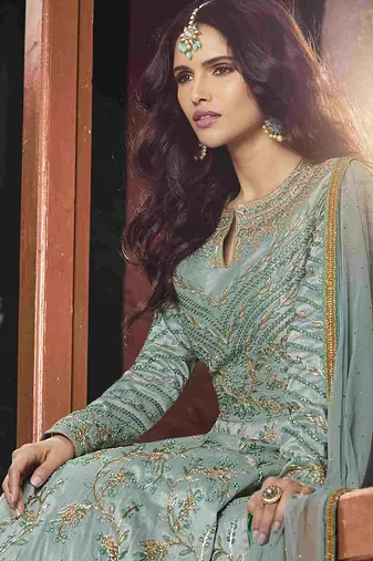 Soft silk party wear gown in light blue color with embroidery work & stone work