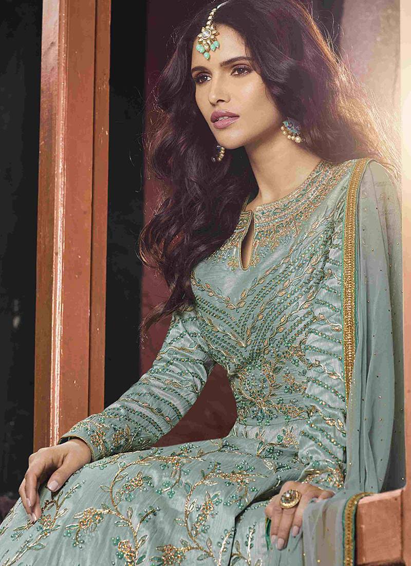 Soft silk party wear gown in light blue color with embroidery work & stone work