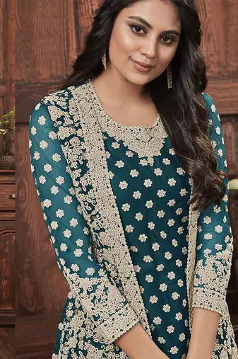 Butterfly net fabric party wear suit in turquoise color with embroidery & crystal stone work