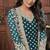Butterfly net fabric party wear suit in turquoise color with embroidery & crystal stone work