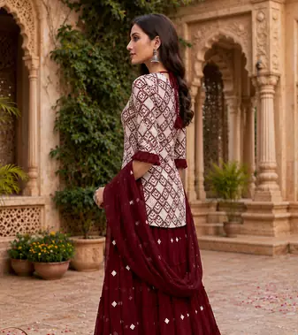 Maroon Elegant Embroidered Kurti With Flowy Sharara And Soft Net Dupatta Perfect For Festive And Wedding Looks