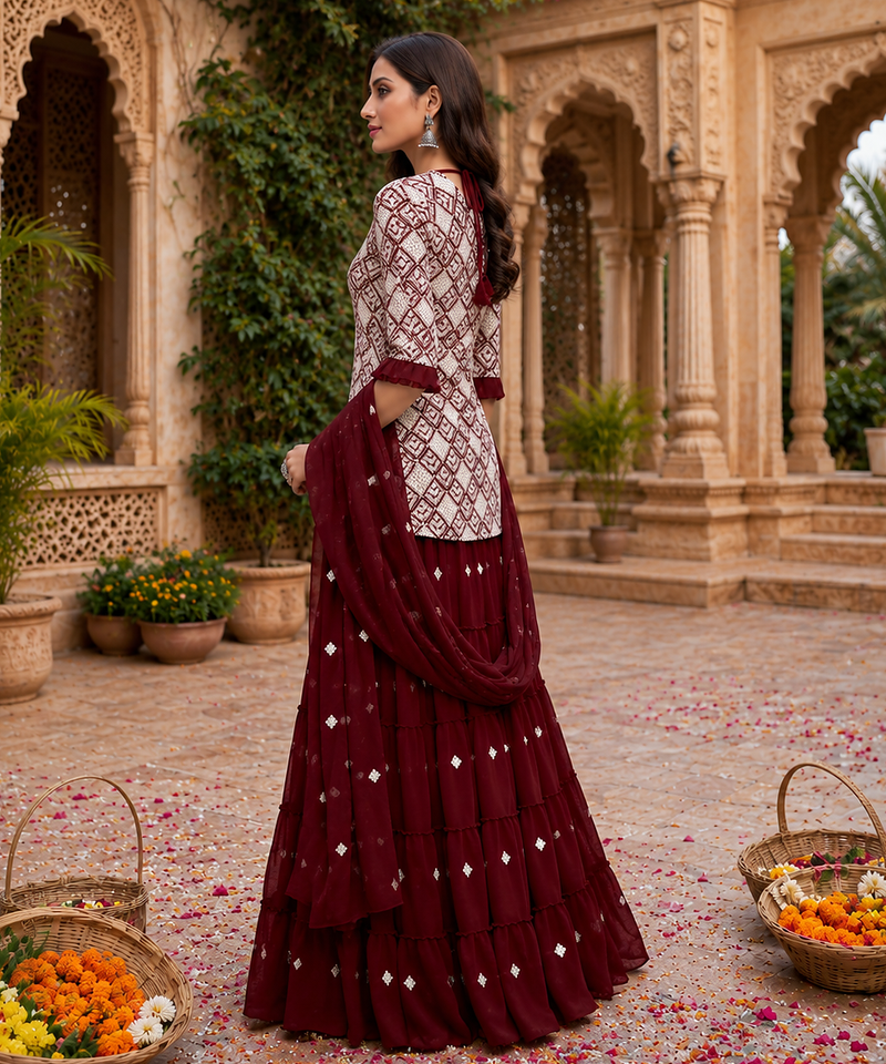 Maroon Elegant Embroidered Kurti With Flowy Sharara And Soft Net Dupatta Perfect For Festive And Wedding Looks
